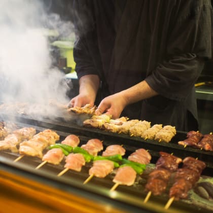 Chef preparing food in Japanese Yakitori restaurant