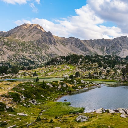 Sunset in the mountain lake (Lake of Pessons, Andorra)